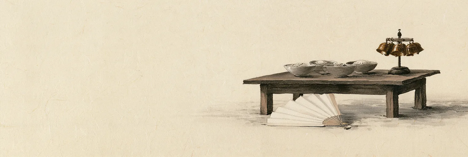 Korean ink-wash painting on aged hanji paper of a low wooden offering table set with a few plain bowls of food, with a cluster of small brass bells hung on a short stand at one end of the table and an open white paper fan lying on the floor in front of it, placed in the right third of the paper and the left two thirds left empty, no people, no faces, no blade